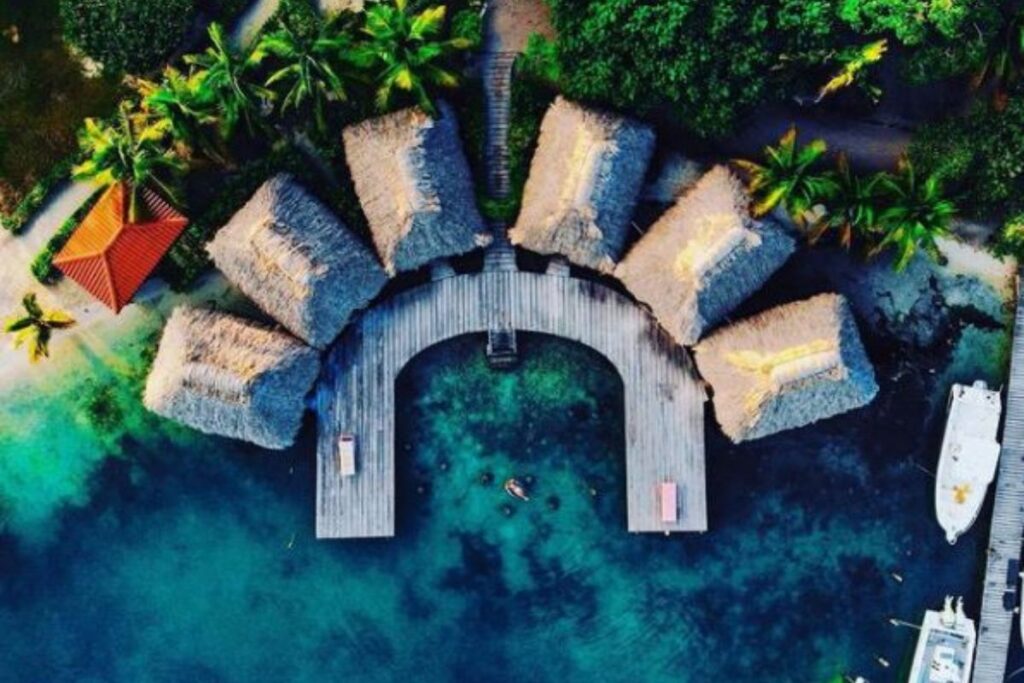 Overwater Cabana Thatched Roof Bungalow at St. George's Caye Resort.jopg