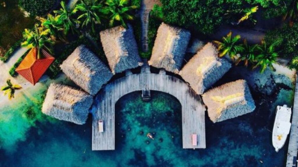 Overwater Cabana Thatched Roof Bungalow at St. George's Caye Resort.jopg