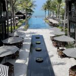 looking out over pool and to the beach in Koi Samui Thailand at the Kimpton