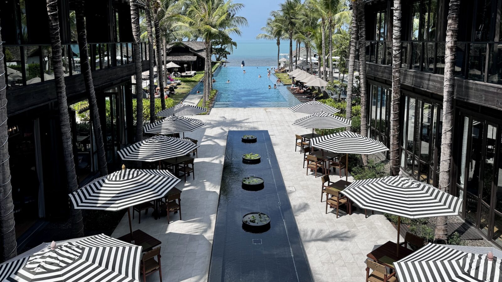 looking out over pool and to the beach in Koi Samui Thailand at the Kimpton