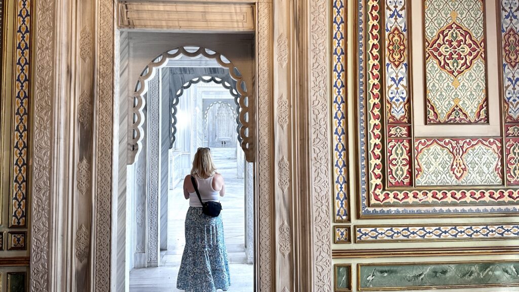 woman standing in the marble hammam at the ciragan palace kempinski in Istanbul, Turkiye