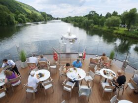Viking longship sailing down a river in Europe