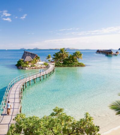 Likuliku Lagoon Resort aerial view of long pier to overwater bungalow