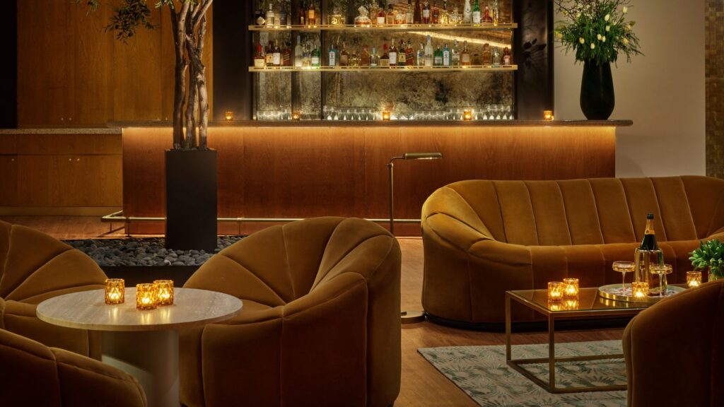 evening with comfortable chairs and bar in event space at Modernhaus Soho