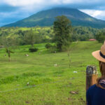 Woman standing in a lush field in Costa Rica