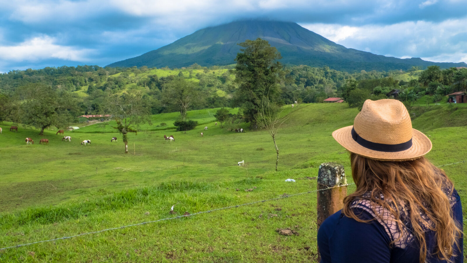 Woman standing in a lush field in Costa Rica