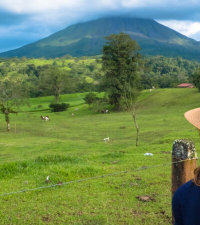 Woman standing in a lush field in Costa Rica