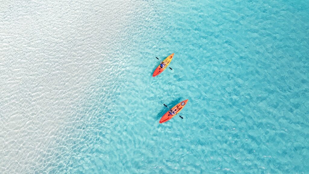 Two people kayaking in the waters around Salterra